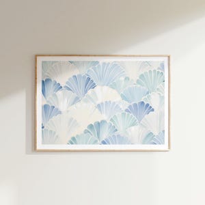 May include: A framed print with a blue and white abstract pattern of overlapping fan shapes. The print has a light, airy feel and would be a great addition to any modern home.