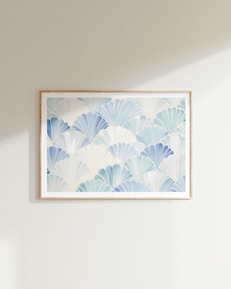 May include: A framed print with a blue and white abstract pattern of overlapping fan shapes. The print has a light, airy feel and would be a great addition to any modern home.