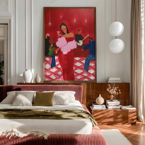 May include: A bedroom featuring a bed with a red-pink, vertically-lined headboard and frame. The bed is made with white linens and an olive green throw. A large painting with a red background and figures at a bar hangs above a wooden dresser.