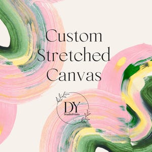 May include: A rectangular canvas print featuring abstract brushstrokes in shades of pink, green, and yellow on a cream background. The text reads Custom Stretched Canvas with a circular logo containing the letters DY and the text StudioPrints.