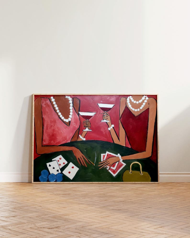 May include: An abstract painting depicts two figures at a table, holding wine glasses. The figures wear red and pink dresses and pearl necklaces. Poker chips and playing cards are on the green table. A small green purse is also visible.