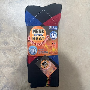 May include: Black thermal socks with a diamond pattern in blue and red. The packaging reads "MENS EXTRA HEAT THERMAL SOCKS" and "10 with LYCRA". The socks are sized for UK 6-11 and EU 39-45. The TOG rating is 1.6.