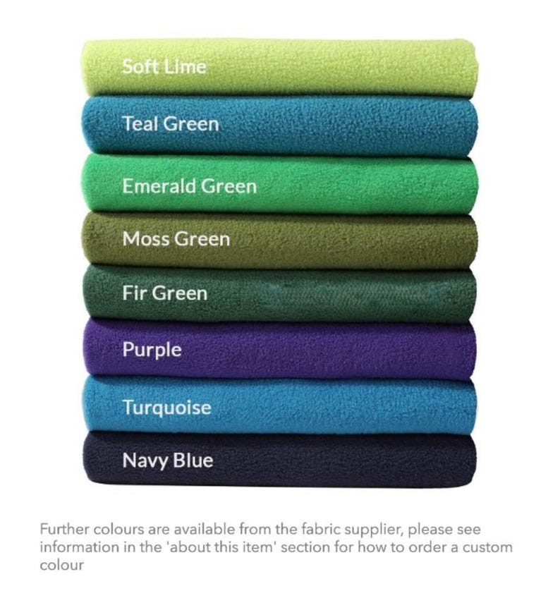 May include: A stack of eight fabric swatches in various shades of green, blue, and purple. The swatches are labeled with the color names: Soft Lime, Teal Green, Emerald Green, Moss Green, Fir Green, Purple, Turquoise, and Navy Blue.