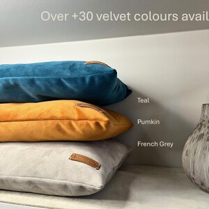 Three cushions together in Teal, Pumkin and French Grey colours