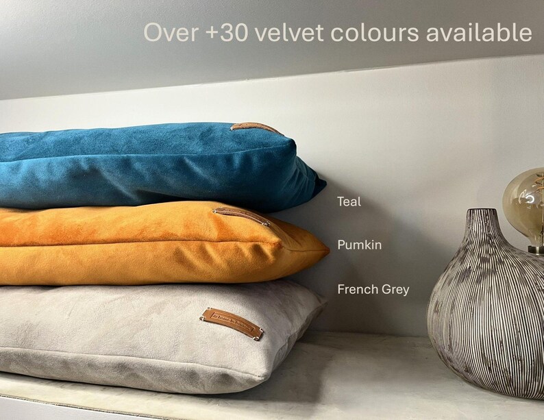 Three cushions together in Teal, Pumkin and French Grey colours