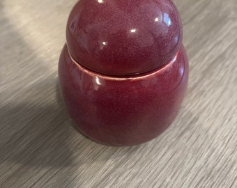 Small red ceramic jars