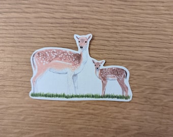 May include: A watercolor illustration of a mother deer and her fawn standing in a grassy field. The deer are brown with white spots and have large, dark eyes.