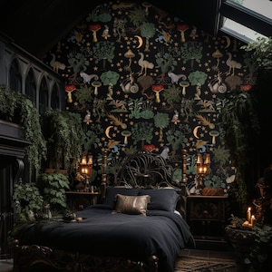 May include: A black metal bed frame with a dark headboard and footboard. The bed is dressed in black bedding and has a gold throw pillow. The wall behind the bed is covered in a black and gold wallpaper with a whimsical pattern of mushrooms, stars, and other forest creatures.