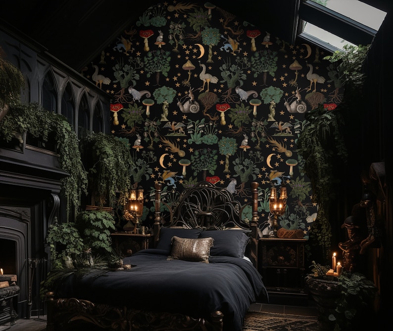 May include: A black metal bed frame with a dark headboard and footboard. The bed is dressed in black bedding and has a gold throw pillow. The wall behind the bed is covered in a black and gold wallpaper with a whimsical pattern of mushrooms, stars, and other forest creatures.