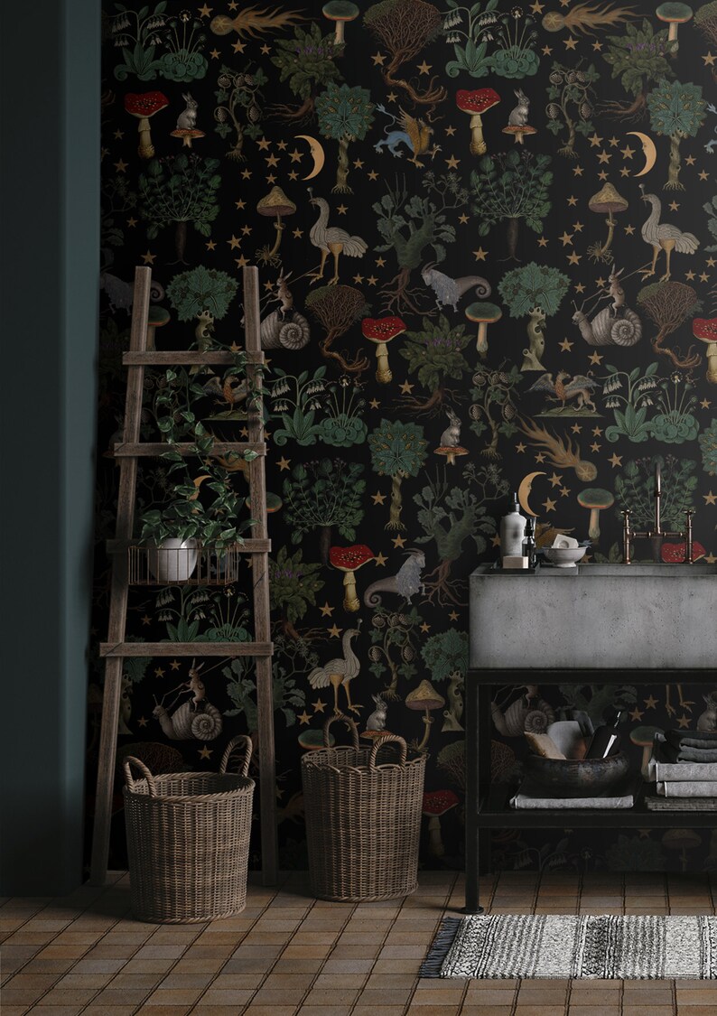 May include: A black and gold wallpaper with a whimsical forest scene featuring mushrooms, stars, and woodland creatures. The wallpaper is displayed in a bathroom setting with a sink, a ladder, and two wicker baskets.