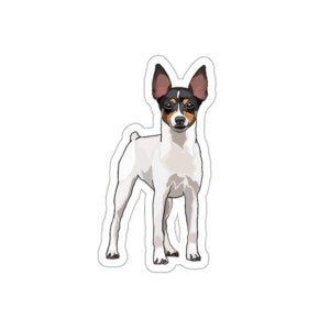 May include: A sticker featuring a cartoon illustration of a Toy Fox Terrier dog. The dog has a white body with black and brown markings on its head and ears. The dog is standing upright with its legs spread.