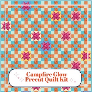 May include: A quilt featuring a repeating grid pattern of light blue and orange squares, interspersed with dark pink floral star motifs on cream, yellow, and blue backgrounds. A white rectangular label displays the text Campfire Glow Precut Quilt Kit.