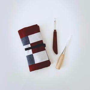 May include: A set of three ceramic mugs with a speckled, matte finish. The mugs are in shades of cream, light gray, and dark gray. Each mug has a simple, minimalist design, perfect for coffee or tea.