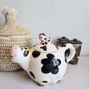 Vintage Black and White Cow with mini cow Top Collectible Teapot.