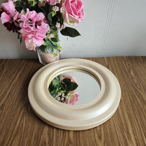 Vinatge round mirror, mid century pearle beige circle plastic makeup mirror from the 1960s-1970s.