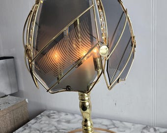 Vintage Bedroom Lamp, Brass Touch Lamp, Three Lights, Three Socket Lamp, Ornate Finial, 6 Convex Panels, Dark Gray Floral Pattern.