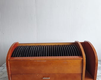 May include: A wooden organizer with a drawer and slots for holding letters or other items. The organizer is brown and has a natural wood finish.