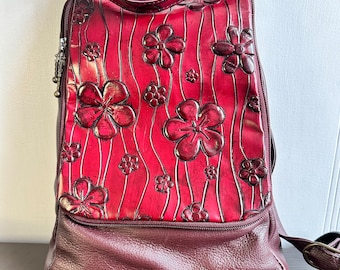 Vintage BACKPACK PURSE leather burgundy leather pocket metal buckles, floral pattern.