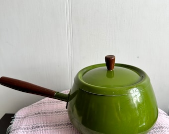 Vintage avocado green fondue pot.