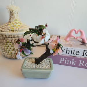 Vintage beautiful colorful stone carved flowering bonsai tree in ceramic pot
