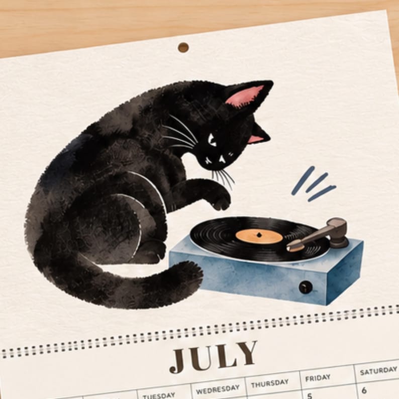 July black cat calendar illustration with whimsical watercolor cat playing with a blue vinyl record player