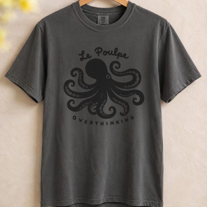 Pepper folded Comfort Colors overthinking octopus shirt.
