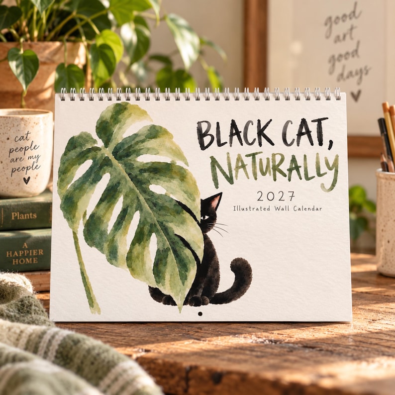 2027 black cat wall calendar with watercolor cat and green monstera leaf cover, illustrated calendar gift for cat lover