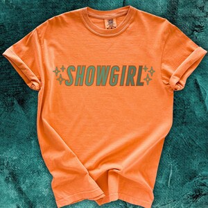 Orange Comfort Colors Tshirt with Aqua/Teal SHOWGIRL text