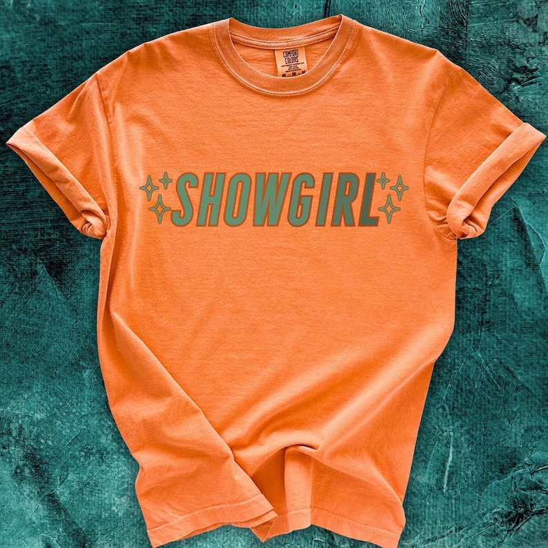Orange Comfort Colors Tshirt with Aqua/Teal SHOWGIRL text