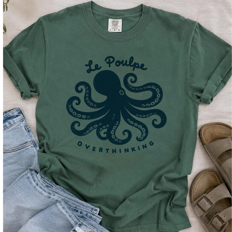 Blue Spruce octopus graphic shirt flat lay.