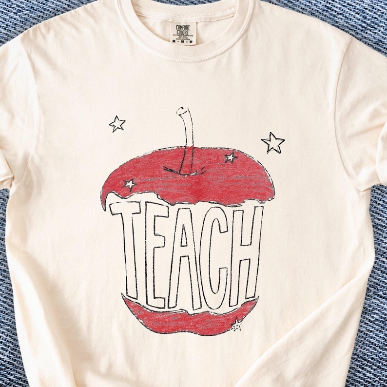 Hand drawn TEACH apple shirt for teachers on ivory tee, vintage childlike apple sketch with imperfect pencil lines and red crayon texture, Free People inspired teacher style