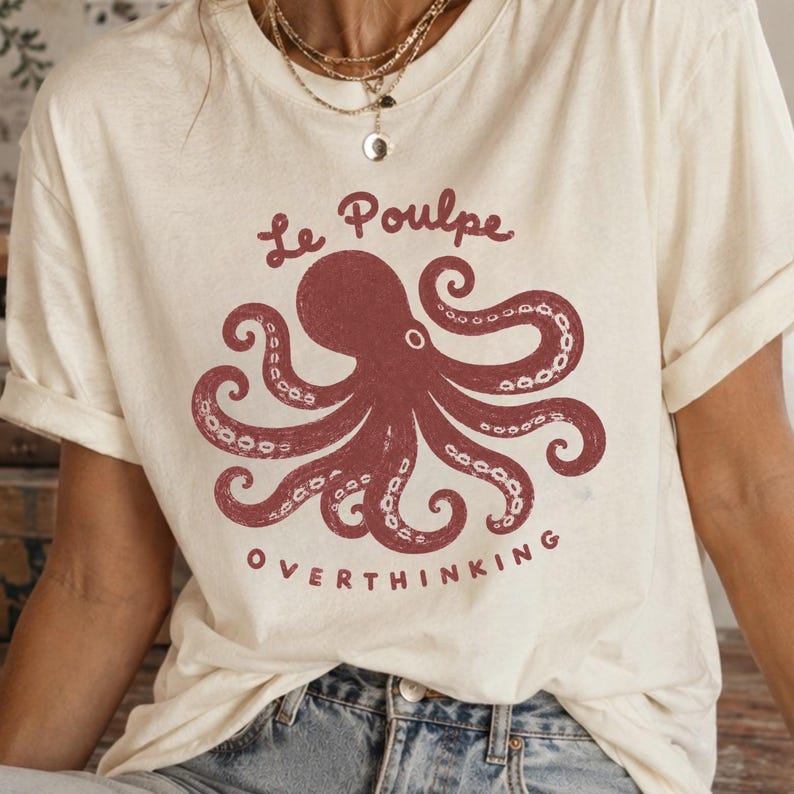 Close-up of hand-drawn octopus graphic on ivory Comfort Colors shirt.