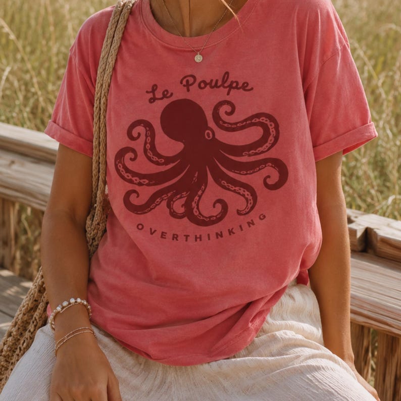 Woman wearing watermelon Comfort Colors octopus graphic tee outdoors.