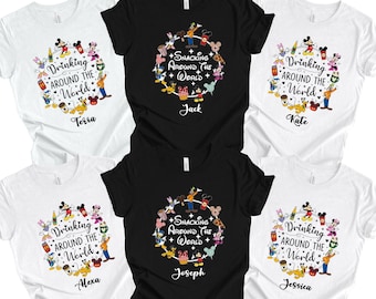 May include: A collection of white and black t-shirts featuring colorful Disney character graphics. The shirts have the phrases "Drinking Around The World" and "Snacking Around The World" with names like Terra, Jack, Kate, Alexa, Joseph, and Jessica.