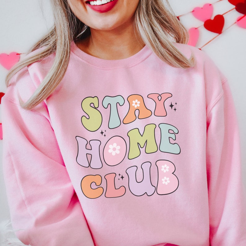 Cozy loungewear for a relaxing staycation Embrace ultimate comfort with our Stay Home Club sweatshirt an essential piece for those who appreciate fashionable and comfortable homebody fashion.