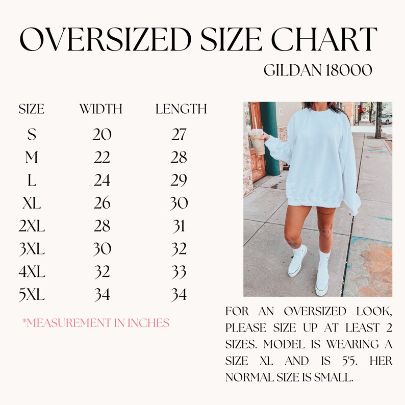 May include: Size chart for Gildan 18000 oversized sweatshirts, showing width and length measurements in inches for sizes S through 5XL. A model is wearing a white sweatshirt in size XL, standing on a sidewalk.