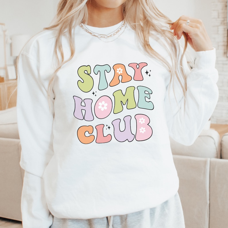 Stay Home Club sweatshirt for cozy lounging Elevate your stay at home experience with this comfy pullover the perfect homebody gift designed for stylish relaxation and comfort.