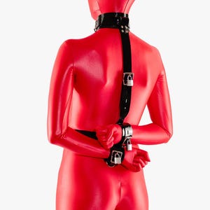 A lockable restraint set featuring a secure neck-to-wrist connection at the back