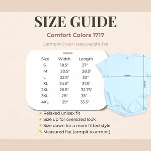 May include: A light blue t-shirt with a size guide. The guide shows measurements in inches for sizes S to 4XL. The text reads "Comfort Colors 1717 Garment-Dyed Heavyweight Tee". Additional text describes the fit and measurement method.