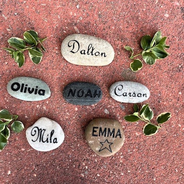 Engraved name stones.  Made to order and can be customized.  Blasted on to natural river rock.