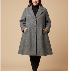 May include: A knee-length, grey and white herringbone patterned coat with a notched lapel collar, long sleeves, and three front buttons. The coat features two side pockets and a flared silhouette, worn over a black turtleneck and black trousers.