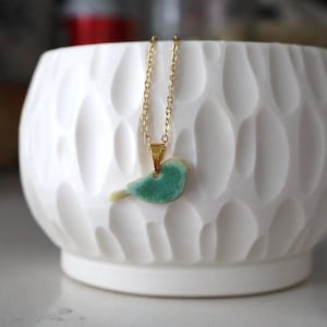 Sweet little bird pendant necklace; teal porcelain pendant with gold chain