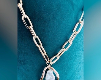 Camila Coelho gold paperclip-style chain necklace with a baroque pearl pendant