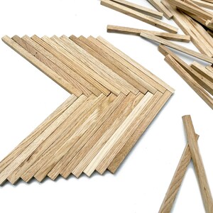 May include: A wooden arrow shape made from thin wooden strips. The arrow is made of natural wood with a light brown color. There are extra wooden strips scattered around the arrow.
