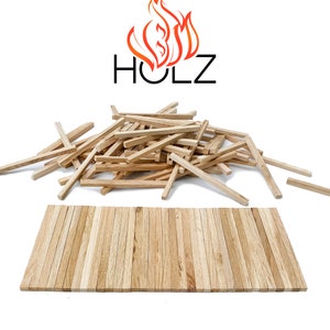 May include: A pile of natural wood sticks, arranged in a rectangular shape, with a logo that says "HOLZ" above the pile. The logo features a stylized orange flame.