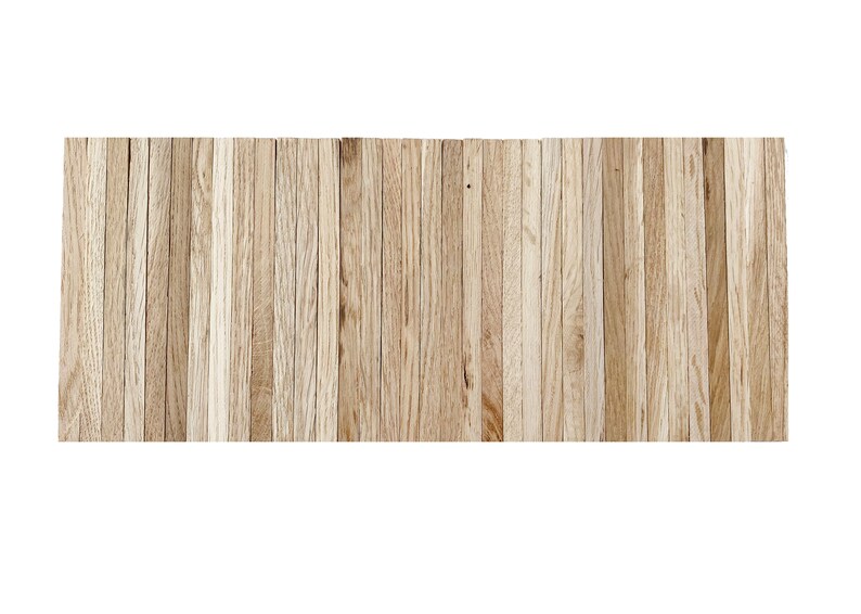 May include: A close-up of a wood panel wall made of many thin, light brown wooden slats.