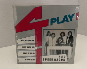 May include: Sealed vinyl record album titled "4 Play" by REO Speedwagon. The album cover features a red "4" graphic and the word "PLAY" in blue. The album cover also features a photo of the band and song titles.