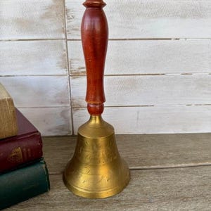 Vintage Brass Bell with Wood Handle and etching on the brass