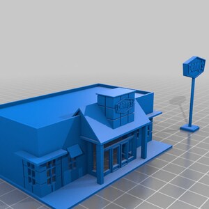 May include: A blue 3D printed model of a Denny's restaurant building with a sign that reads "Denny's".