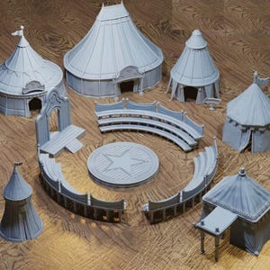 May include: A set of gray miniature circus tents and a circular stage with benches. The tents have a variety of shapes and sizes, and the stage is decorated with a star in the center.